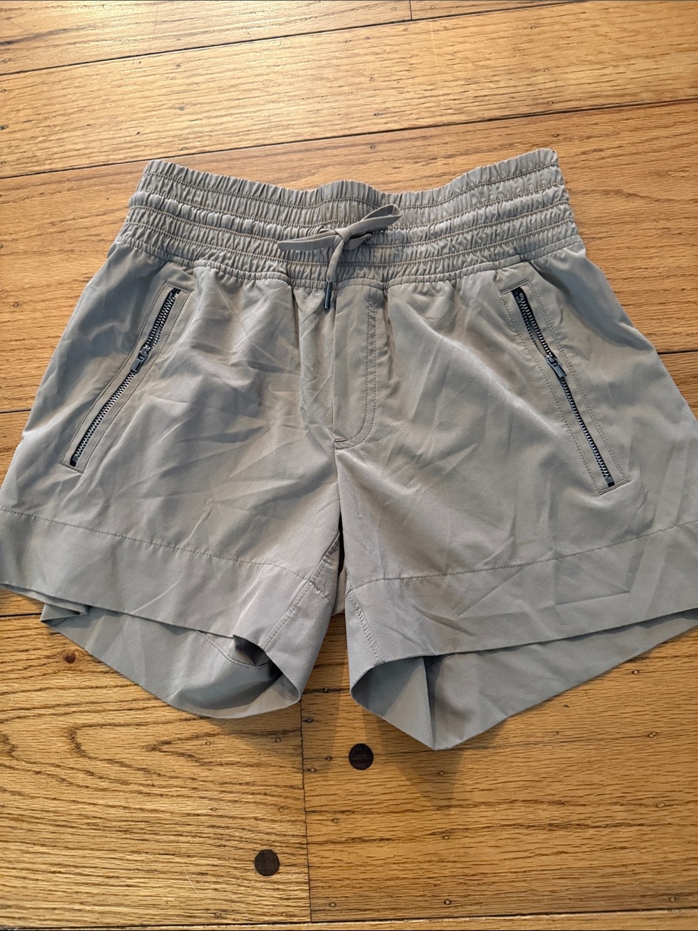 Athleta Light Gray Athletic Shorts with Zipper Pockets